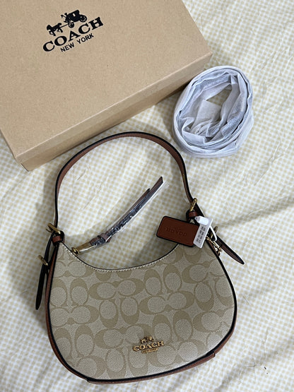 Coach Klee Hobo Bag in Signature Canvas (Brown / Tan)